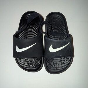 Nike Kids Black Slide Sandals with White Swoosh Accent